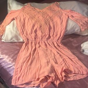 Cold shoulder 3/4 sleeve jumper in coral.